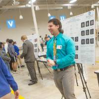 high school students interacting with a male presenter
